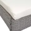 Close-up of the corner of a grey rattan chair with a cream cushion. Podgląd zdjęcia produktu