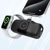 A black power bank is shown charging an Apple Watch and a smartphone. Produktbild-Vorschau