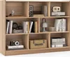 A wooden bookshelf filled with books and decorative items. Produktbild-Vorschau