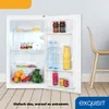 An open refrigerator filled with food and drinks, placed on a wooden floor with a chair in the background. Produktbild-Vorschau