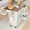 A kitchen island cart with a wooden top, white cabinet doors, and drawers, set up in a kitchen or dining area with bar stools and breakfast items on top. Anteprima dell’immagine prodotto