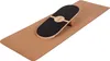 A balance board and roller are placed on a yoga mat. Produktbild-Vorschau