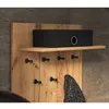 A wooden coat rack with a shelf and hooks, holding a black box and a coat. Produktbild-Vorschau