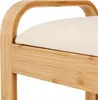 A close-up view of a section of a bamboo shoe rack with a beige seat cushion. Produktbild-Vorschau