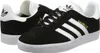 A pair of black Adidas Gazelle sneakers with white stripes and soles. Náhled obrázku produktu