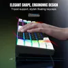 A hand is shown typing on a keyboard with RGB lighting. The image highlights the keyboard's design and features. Produktbild-Vorschau