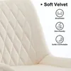 Close-up of a beige velvet chair with diamond stitching, highlighting its features. Produktbild-Vorschau