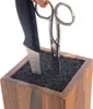 A knife block with a knife and scissors inserted into it. Náhled obrázku produktu