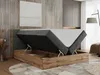 A bedroom scene with a bed that has its storage compartment open. Produktbild-Vorschau