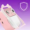 A close-up shot of a pink toy camera with a cute animal face design, against a gradient purple and white background. A shield icon is visible in the upper right corner. Anteprima dell’immagine prodotto