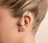 Close-up of a person's ear with a hearing aid. Produktbild-Vorschau