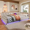 A modern bedroom with a beige daybed, decorated with artwork and plants. Náhľad obrázku produktu