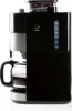 A black coffee maker with a glass carafe filled with coffee, set against a white background. Podgląd zdjęcia produktu