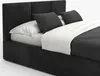 A black upholstered bed with white bedding and gray pillows. Produktbild-Vorschau