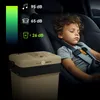A child sleeping in a car seat next to a portable cooler. Anteprima dell’immagine prodotto