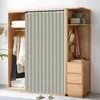 A closet with clothes hanging and folded, a curtain divider, and a small cabinet with drawers. Náhľad obrázku produktu