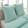 Two pillows and a duvet cover on a bed, with a window in the background. Produktbild-Vorschau