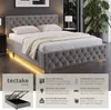 A modern bedroom setting with a grey upholstered bed. Produktbild-Vorschau