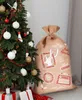 A Christmas sack decorated with stamps is placed next to a decorated Christmas tree. Podgląd zdjęcia produktu