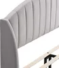 Close-up view of a gray upholstered headboard and part of a bed frame. Podgląd zdjęcia produktu