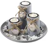 A decorative tray with three candle holders, filled with white and gray stones. Náhled obrázku produktu