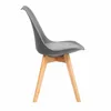 A side view of a dark gray chair with wooden legs on a white background. Náhľad obrázku produktu