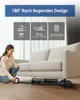 A woman is demonstrating a floor cleaning device under a sofa. Produktbild-Vorschau