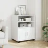 A white roll cabinet with two doors and shelves, placed in a room next to a sofa and curtains. Podgląd zdjęcia produktu