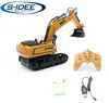 A remote-controlled excavator toy and its accessories are displayed on a white background. Náhľad obrázku produktu