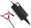 A black battery charger with red and black alligator clips is shown on a white background. Produktbild-Vorschau