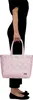 A person wearing black clothes and black ballet flats holds a pink woven shopping basket. Produktbild-Vorschau
