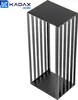 A black metal firewood rack with a slatted design, shown against a white background. Náhled obrázku produktu
