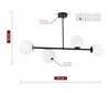 A black ceiling lamp with four white glass globes, shown with dimensions and technical specifications. Produktbild-Vorschau