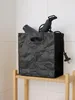 Schwarze Kunststoffbox in Knitteroptik mit Föhn im Badezimmer Produktbild-Vorschau