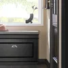 SoBuy Schuhbank FSR82-L-SCH neben einem Fenster mit Vase und Hut im Hintergrund Produktbild-Vorschau