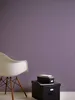 A white chair and two black storage boxes are placed against a purple wall. Podgląd zdjęcia produktu