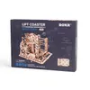 The image shows the packaging of a wooden model kit for a roller coaster. Voir les images du produit