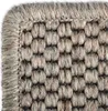 Close-up of a woven rug with a textured pattern and a bound edge. Produktbild-Vorschau