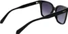 A pair of black Polaroid sunglasses shown from a side-angle against a white background. Produktbild-Vorschau