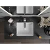 A top-down view of a bathroom vanity with two sinks and faucets, decorated with dried flowers and a candle. Podgląd zdjęcia produktu