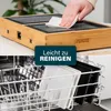 A collage showing a person cleaning a grill and the grill plates in a dishwasher. Produktbild-Vorschau
