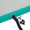 A close-up view of an air valve and hose connection on an inflatable mat. Produktbild-Vorschau