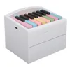 A white box with piano keys on top. Produktbild-Vorschau
