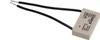 A beige capacitor with two black wires attached, isolated on a white background. Produktbild-Vorschau