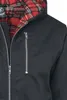 Close-up of a black hooded jacket with a red plaid lining. Produktbild-Vorschau