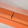 A close-up view of the wooden frame and polycarbonate sheeting of a greenhouse. Produktbild-Vorschau