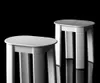 Two white stools are shown against a black background. Anteprima dell’immagine prodotto