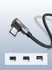 A close-up of a UGREEN USB-C cable with a right-angle connector, shown against a gradient background. Below the cable are three circular insets illustrating different connector types, with checkmarks or crosses indicating compatibility. Podgląd zdjęcia produktu