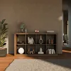 A bookshelf with decorative items and books in a room setting. Produktbild-Vorschau