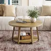 A round coffee table with a lower shelf is placed in a living room setting, in front of a sofa. Produktbild-Vorschau